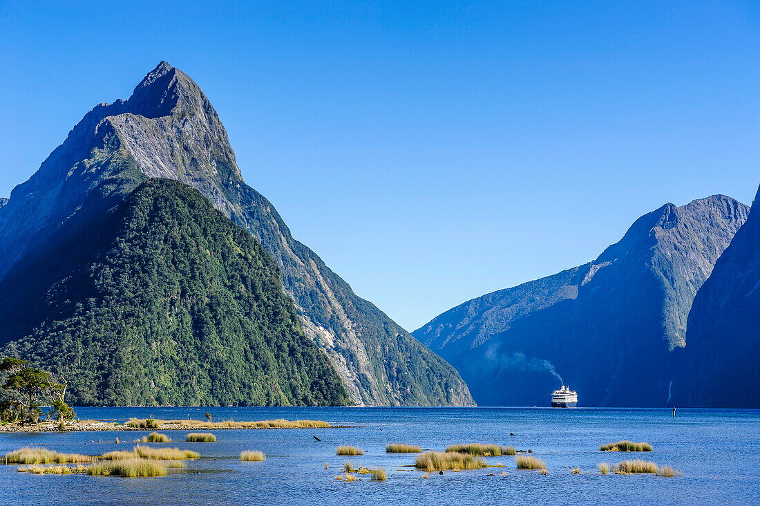 Cruise ship passing through Milford Sound, Fiordland National Park, UNESCO World Heritage Site, South Island, New Zealand, Pacific