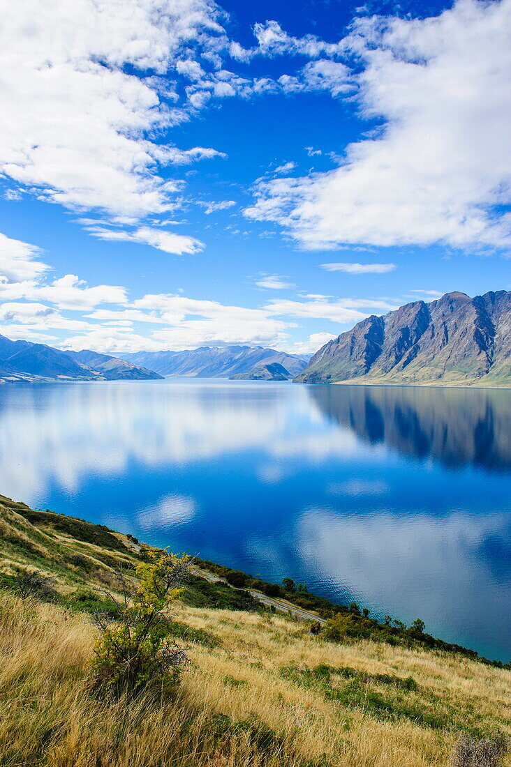 Cloud reflections in Lake Hawea, Haast Pass, South Island, New Zealand, Pacific