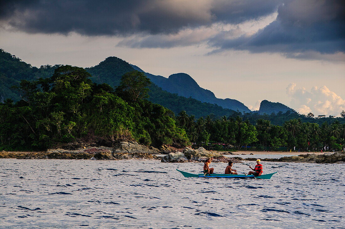 Outrigger cruising on the waters near the Puerto Princesa underground river, Palawan, Philippines, Southeast Asia, Asia