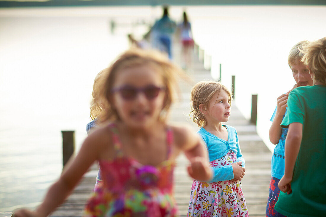 Children on a jetty, lake Starnberg, Upper Bavaria, Bavaria, Germany