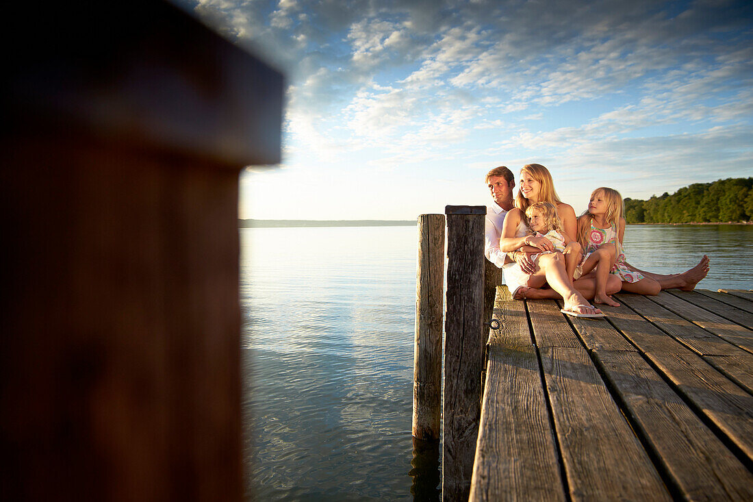 Family on a jetty at lake Starnberg, Upper Bavaria, Bavaria, Germany