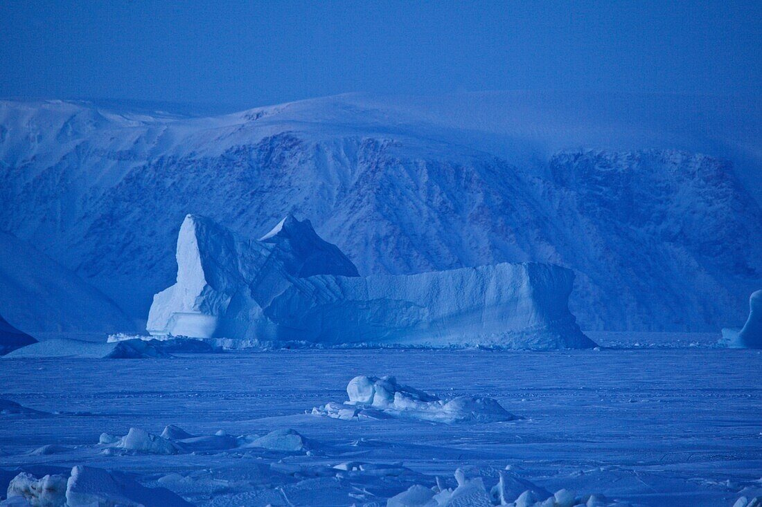 Frozen iceberg in the ocean at Qaanaaq, Northwest Greenland, Greenland