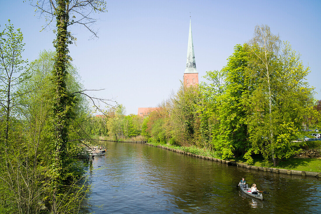 Canoying on the river Trave, Lubeck cathedral, Lubeck, Schleswig-Holstein, Germany