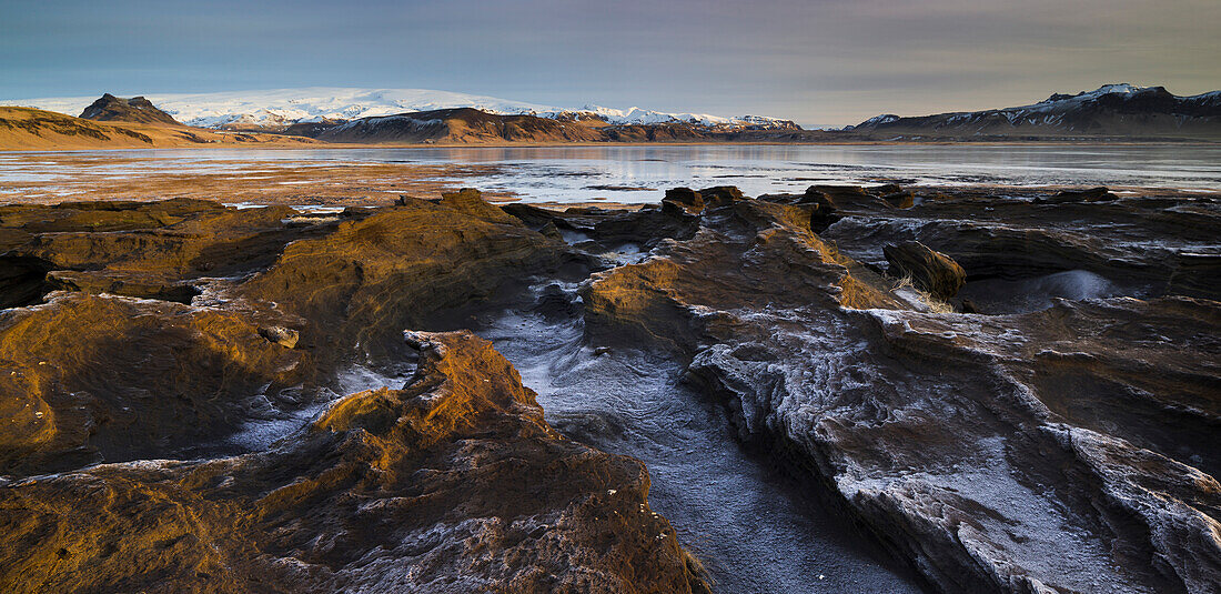 Rock formations in the Dyrholaos bay, Dyrholar, South Island, Island