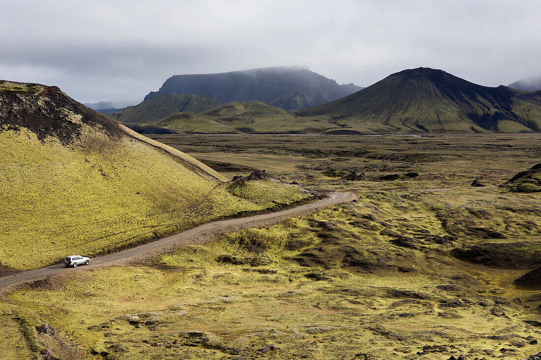 '4 wheel drive vehicle driving down a remote road; Iceland'