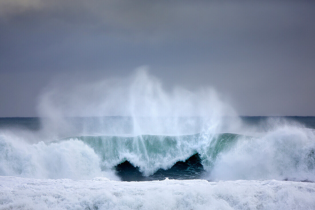 'Dramatic ocean wave off the coast of Southern Iceland near the Blue Lagoon; Grindavik, Iceland'