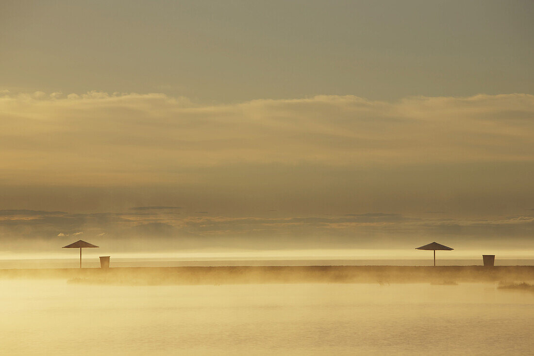 'Northern Lake Baikal at dawn on a misty summer morning; Severobaikalsk, Buryatia, Siberia, Russia'