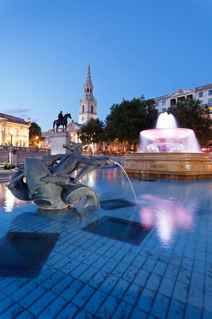 Fountain with statue of George IV and St. Martin-in-the-Fields church, Trafalgar Square, London, England, United Kingdom, Europe