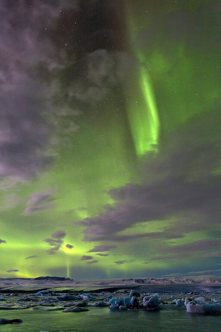 The Aurora Borealis (Northern Lights) captured in the night sky over Jokulsarlon glacial lagoon on the edge of the Vatnajokull National Park, during winter, South Iceland, Iceland, Polar Regions