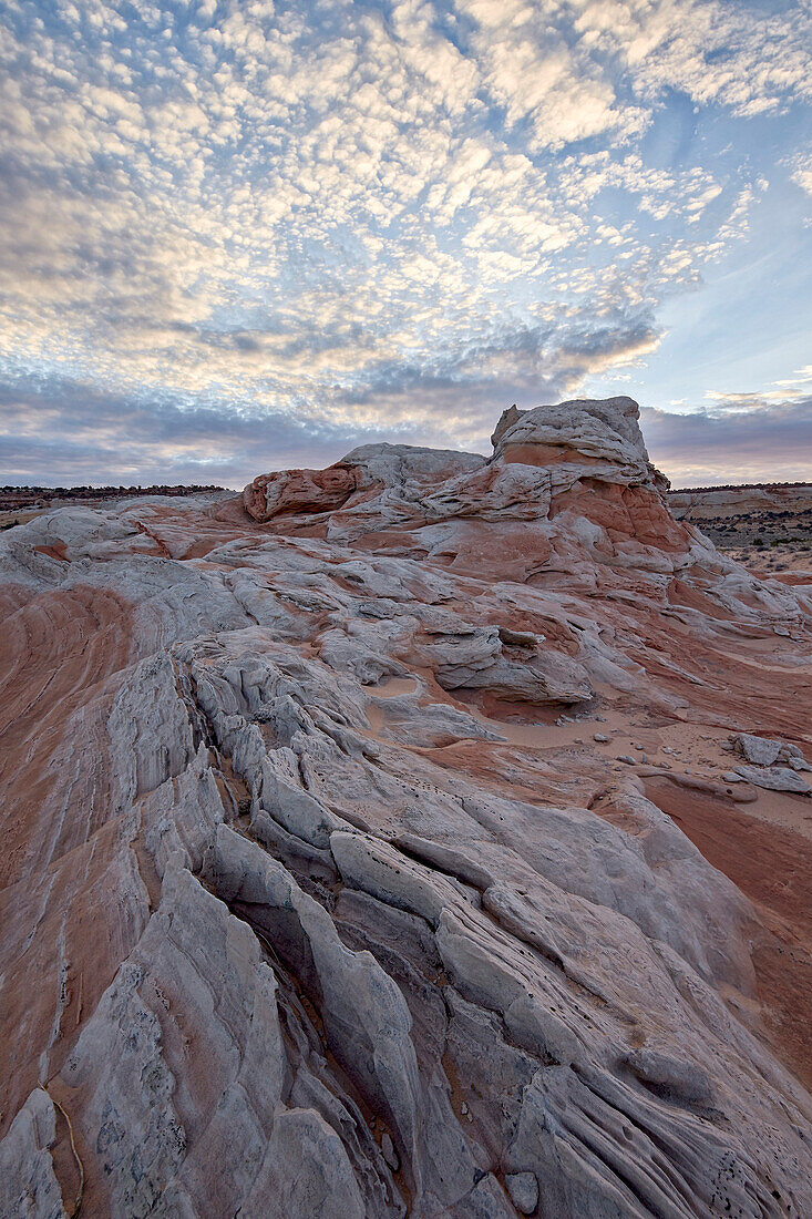 Clouds over white and salmon sandstone, White Pocket, Vermilion Cliffs National Monument, Arizona, United States of America, North America