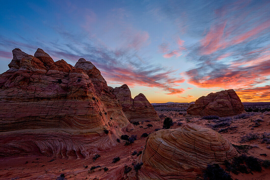 Orange clouds over sandstone cones, Coyote Buttes Wilderness, Vermilion Cliffs National Monument, Arizona, United States of America, North America