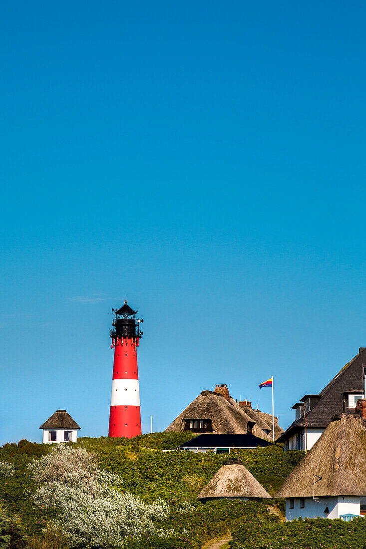 Thatched houses and lighthouse, Hoernum, Sylt Island, North Frisian Islands, Schleswig-Holstein, Germany