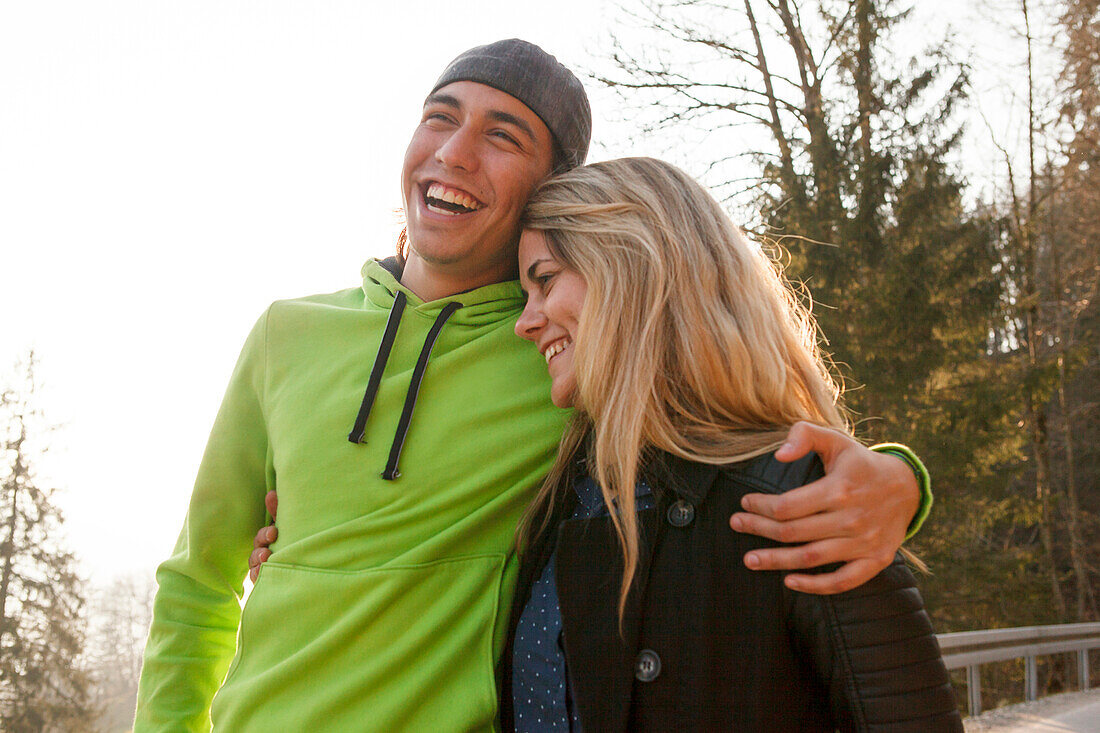 Laughing young couple, Grosser Alpsee, Immenstadt, Bavaria, Germany