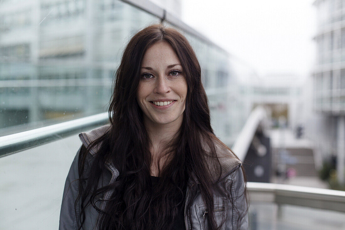 Young woman smiling at camera, Munich, Bavaria, Germany