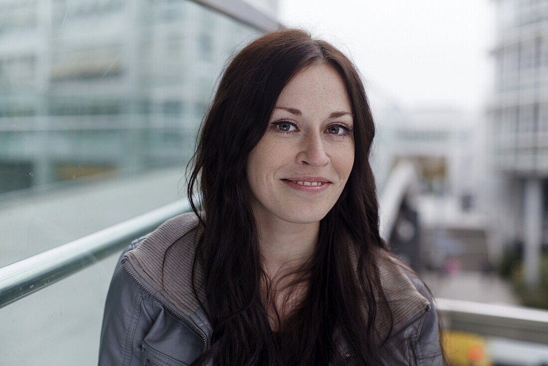 Young woman smiling at camera, Munich, Bavaria, Germany