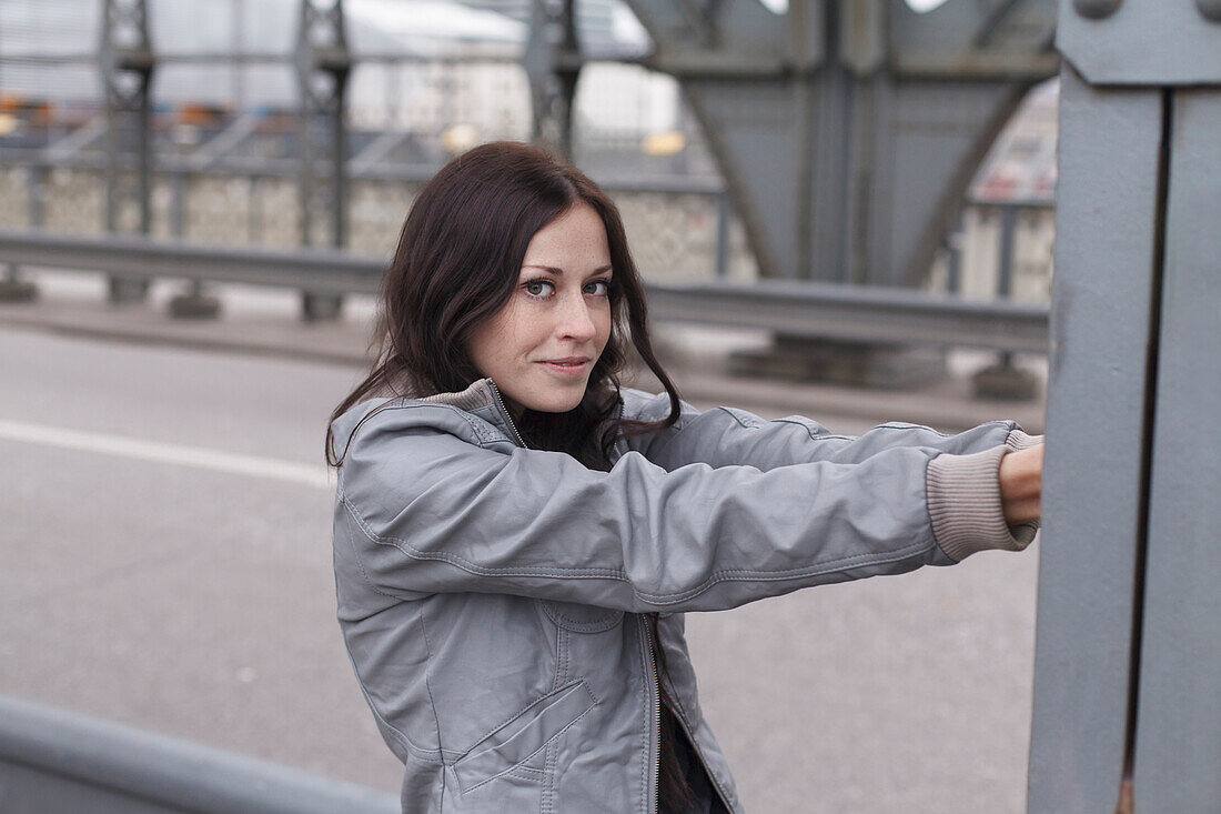 Young woman on Hacker Bridge, Munich, Bavaria, Germany
