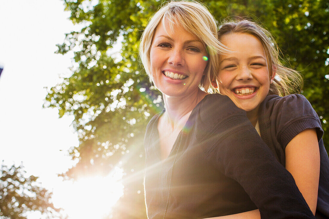 Mother and daughter hugging