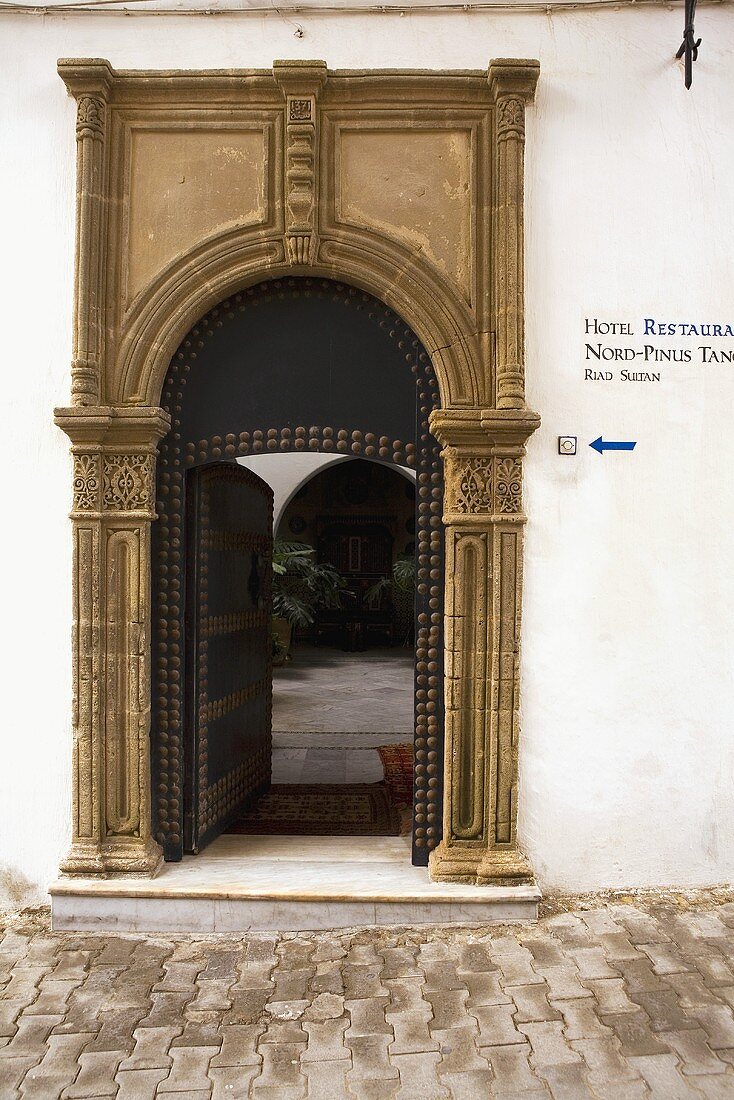 Imposing stone portal with a passageway to a courtyard