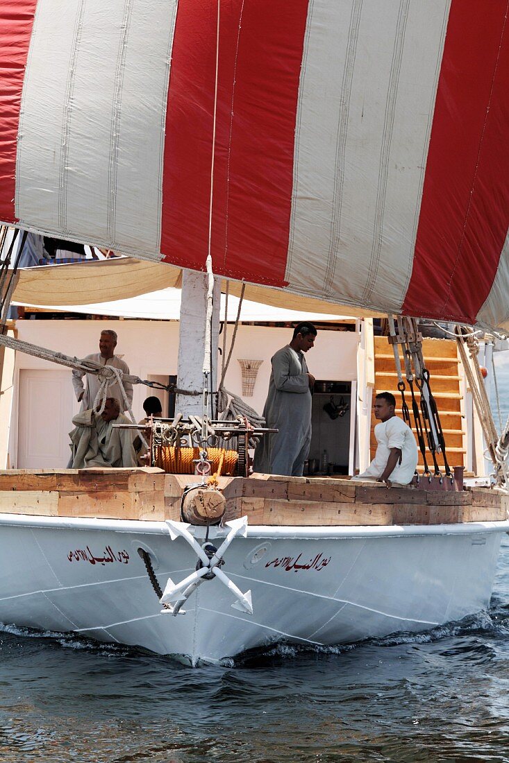 Passengers on the deck of a sailing boat on the River Nile, Egypt