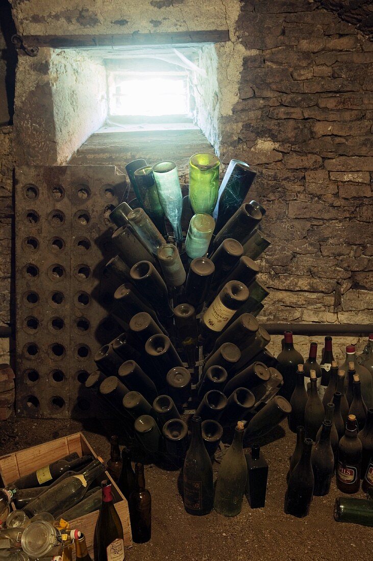 A former wine cellar with dusty bottle racks