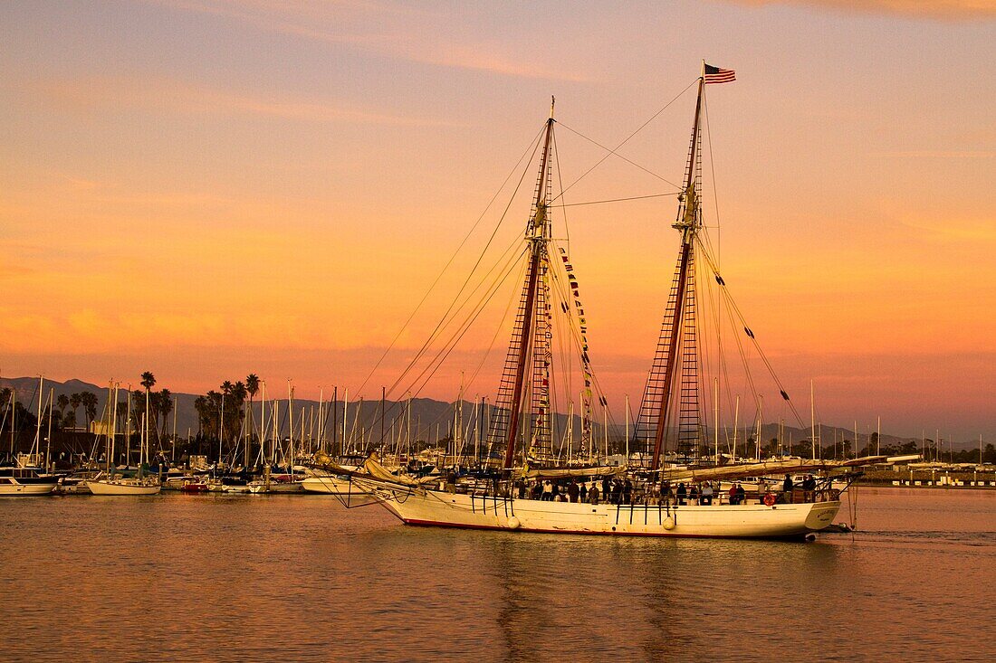 Tall ship entering Channel Islands harbor at sunset