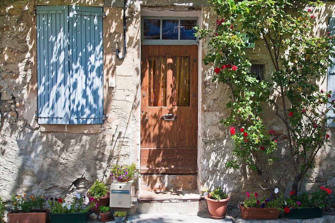 Close up of a house facade with flowers in Provence, France, Europe