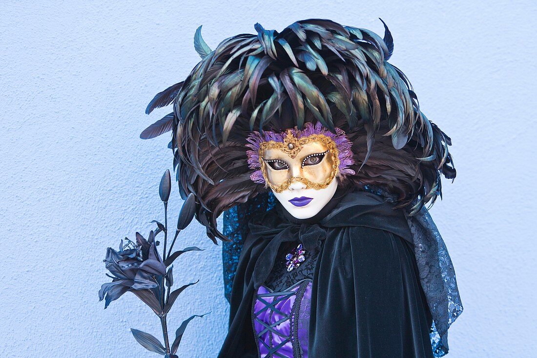 A masked woman at the carnival in Venice, Italy, Europe