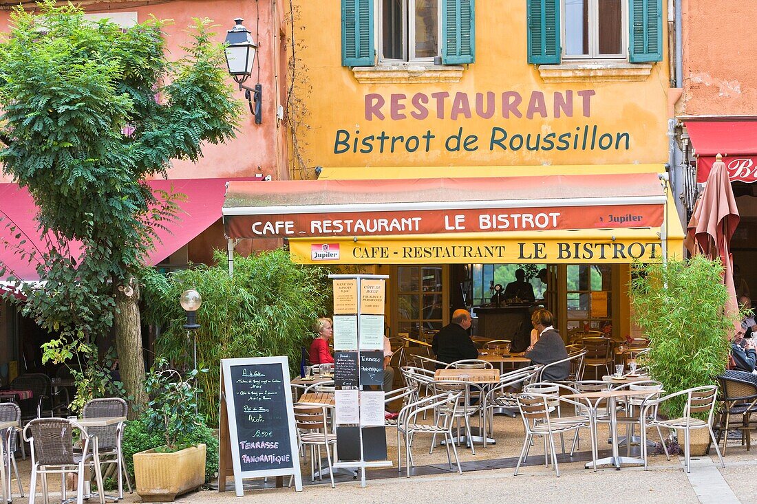 People enjoying lunch in a bistro in Roussillon, Provence, France, Europe