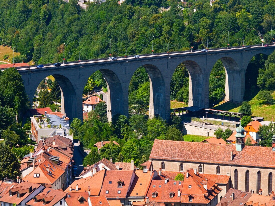View of Fribourg and the old bridge in Saane River, Switzerland