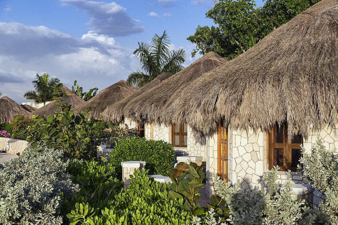The Spa Retreat boutique hotel cottages with thatched roof.