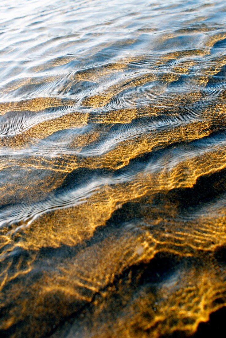 Ripples on calm shallow sea water surface