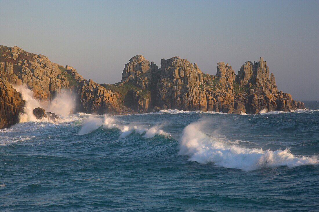 Rough sea at Treen Cornwall with Logans Rock in the background