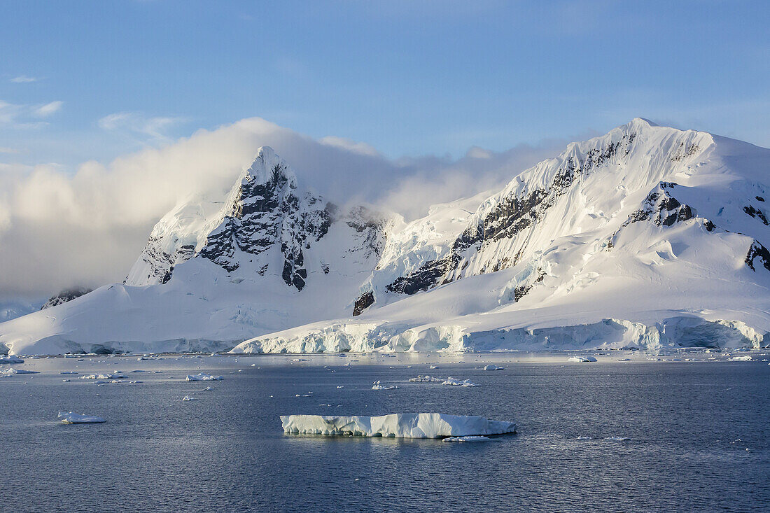 Snow-capped mountains of Cuverville Island, Errera Channel, Antarctica.