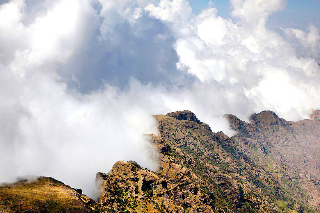 Landscape in the Simien Mountains National Park  Clouds are moving up at the edge of the escarpment forming a dramatic background  The Simien Semien, Saemen, Simen Mountains National Park is part of the UNESCO World heritage and is listed in the red list 