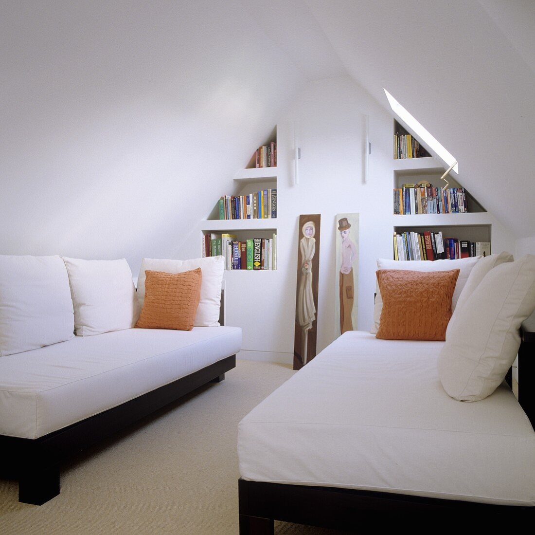 Attic room (minimalist design) with single beds under a pitched roof and built in shelves