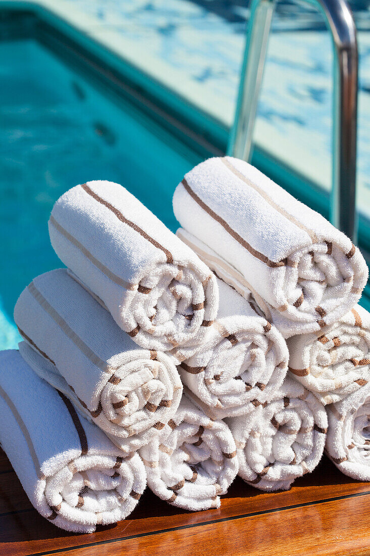 Prepared towels next to Swimming Pool. Cunard Liner Queen Victoria.