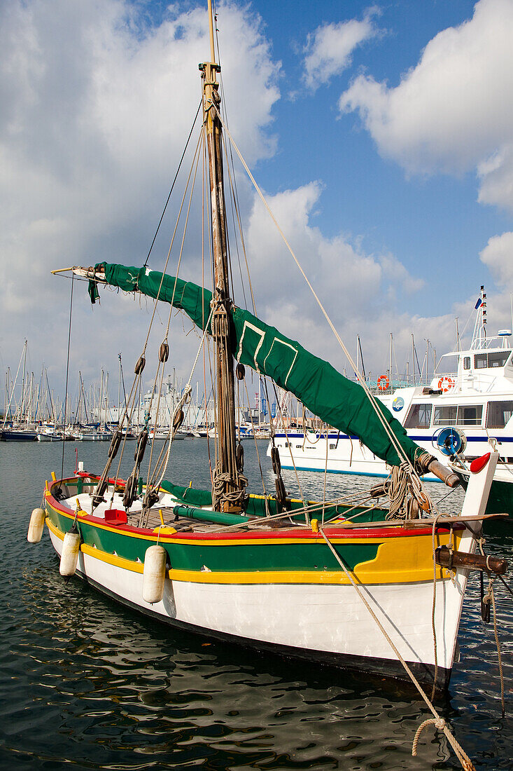 Traditional fishing boat alongside Toulon waterfront France.