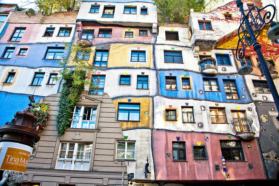 Hundertwasserhaus (1985) is an apartment house built in the style following the Moldiness Manifesto attributed the Austrian artist Friedensreich Hundertwasser. This expressionist Viennese landmark includes a forested roof terrace, rainbow hues, undulating