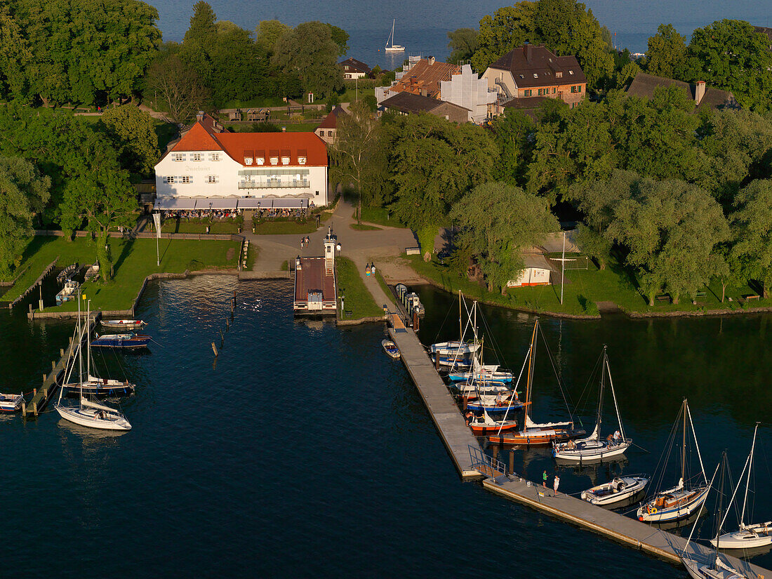 Aerial shot of Hotel Restaurant Inselwirt, Fraueninsel, lake Chiemsee, Bavaria, Germany