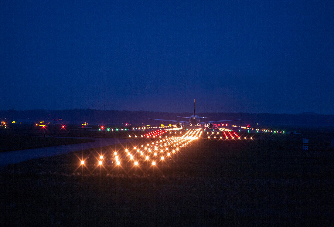 Landing plane at night, Munich Airport, Munich, Bavaria, Germany