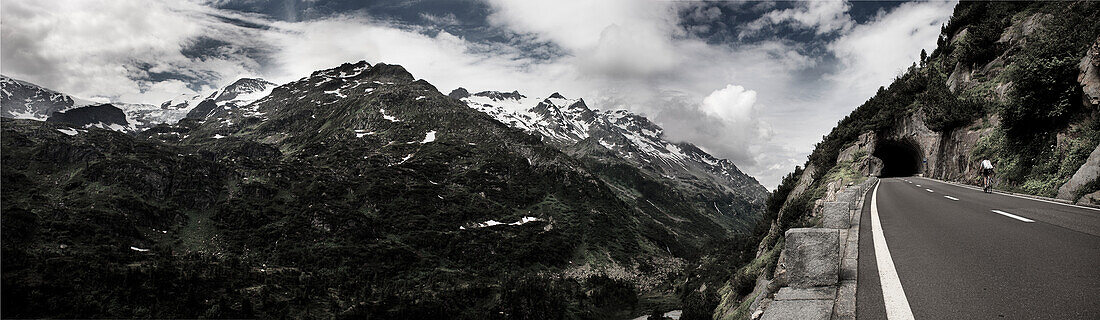 Cyclist on mountain pass, ascend to Sustenpass from Innertkirchen, Bernese Oberland, Switzerland