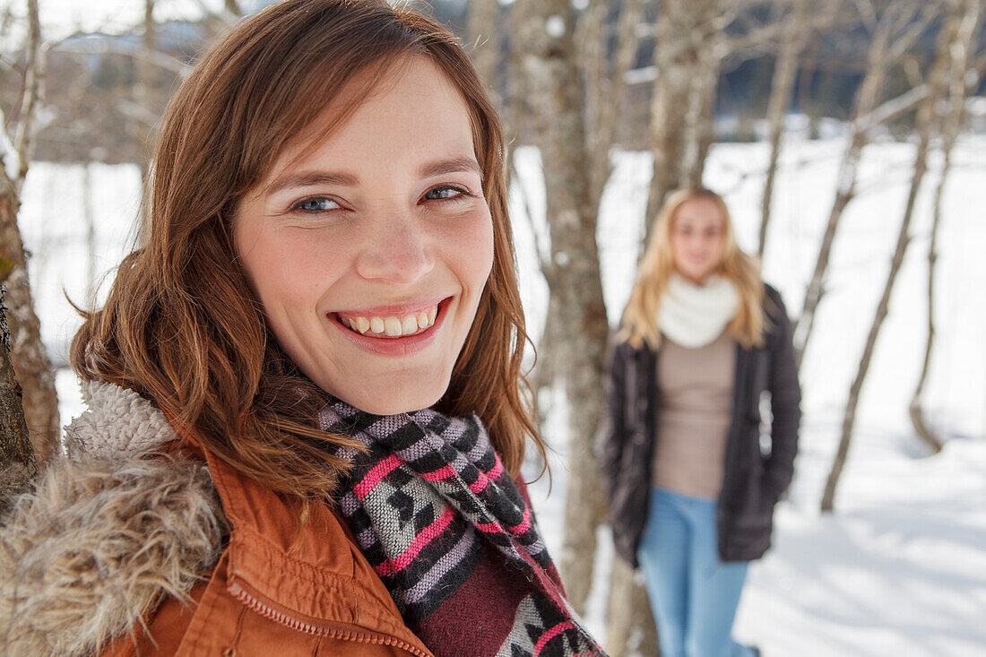Young woman smiling at camera, Spitzingsee, Upper Bavaria, Germany