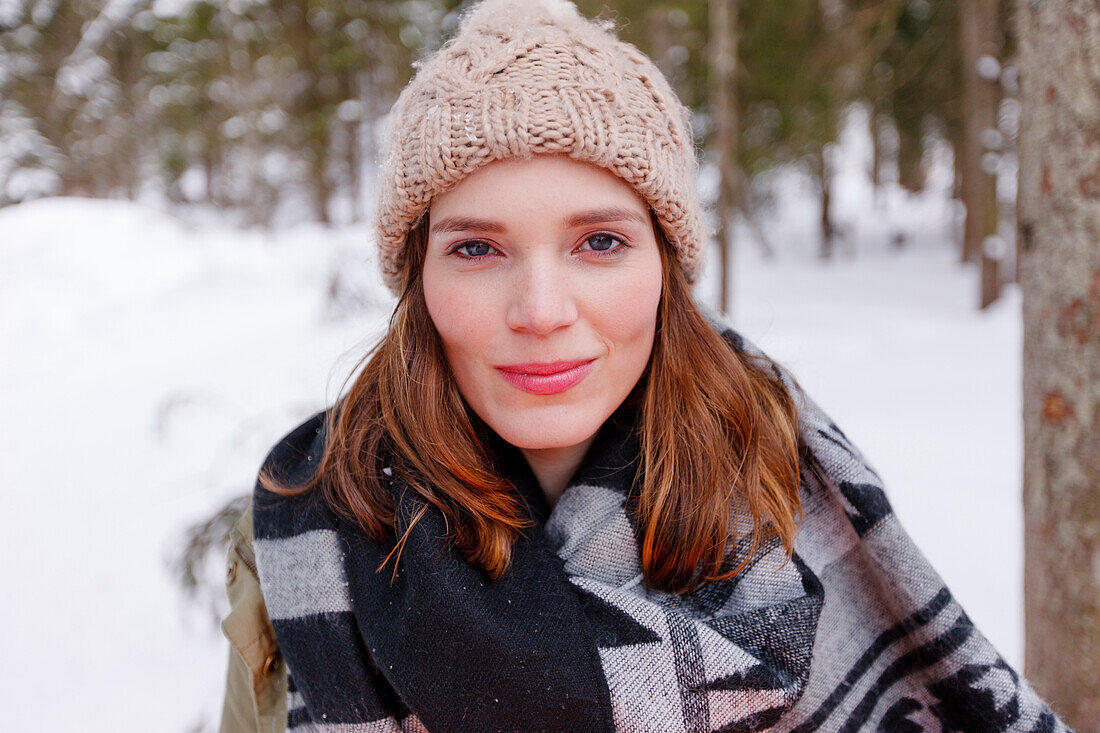 Young woman looking at camera, Spitzingsee, Upper Bavaria, Germany