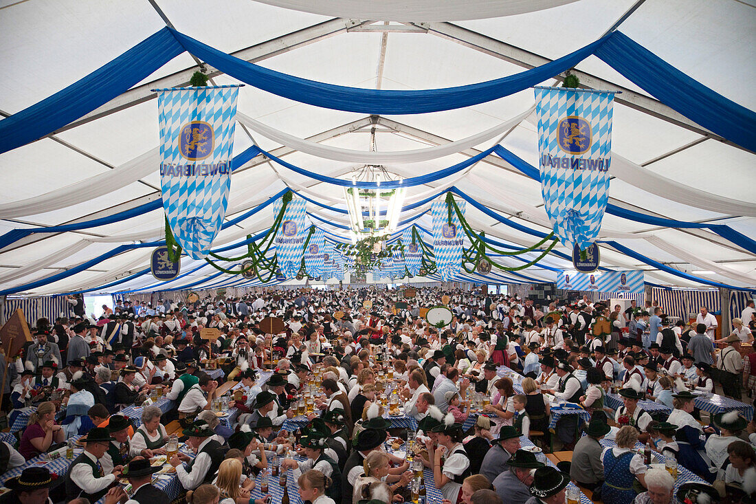 Germany, Bavaria, Munich, Oktoberfest, People in Bavarian Costume inside Beer Tent