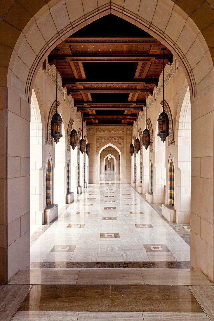 Arched hallways of the Grand Mosque in Muscat, Oman