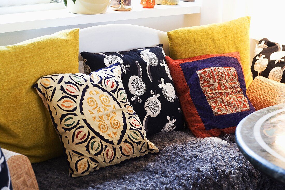 Various patterned cushions on a sofa