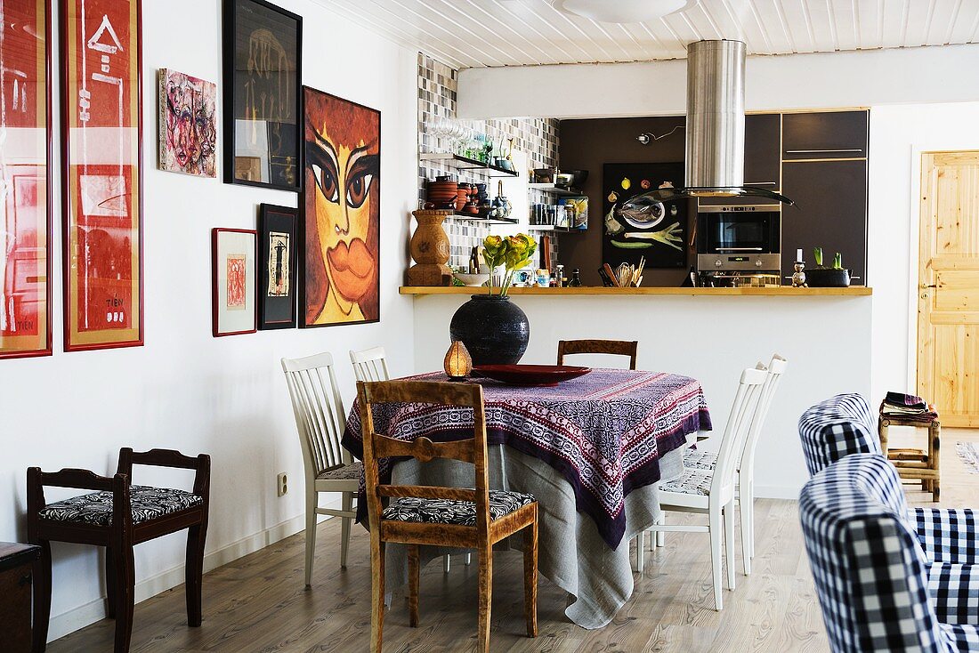 An open-plan living room with a dining area and a kitchen