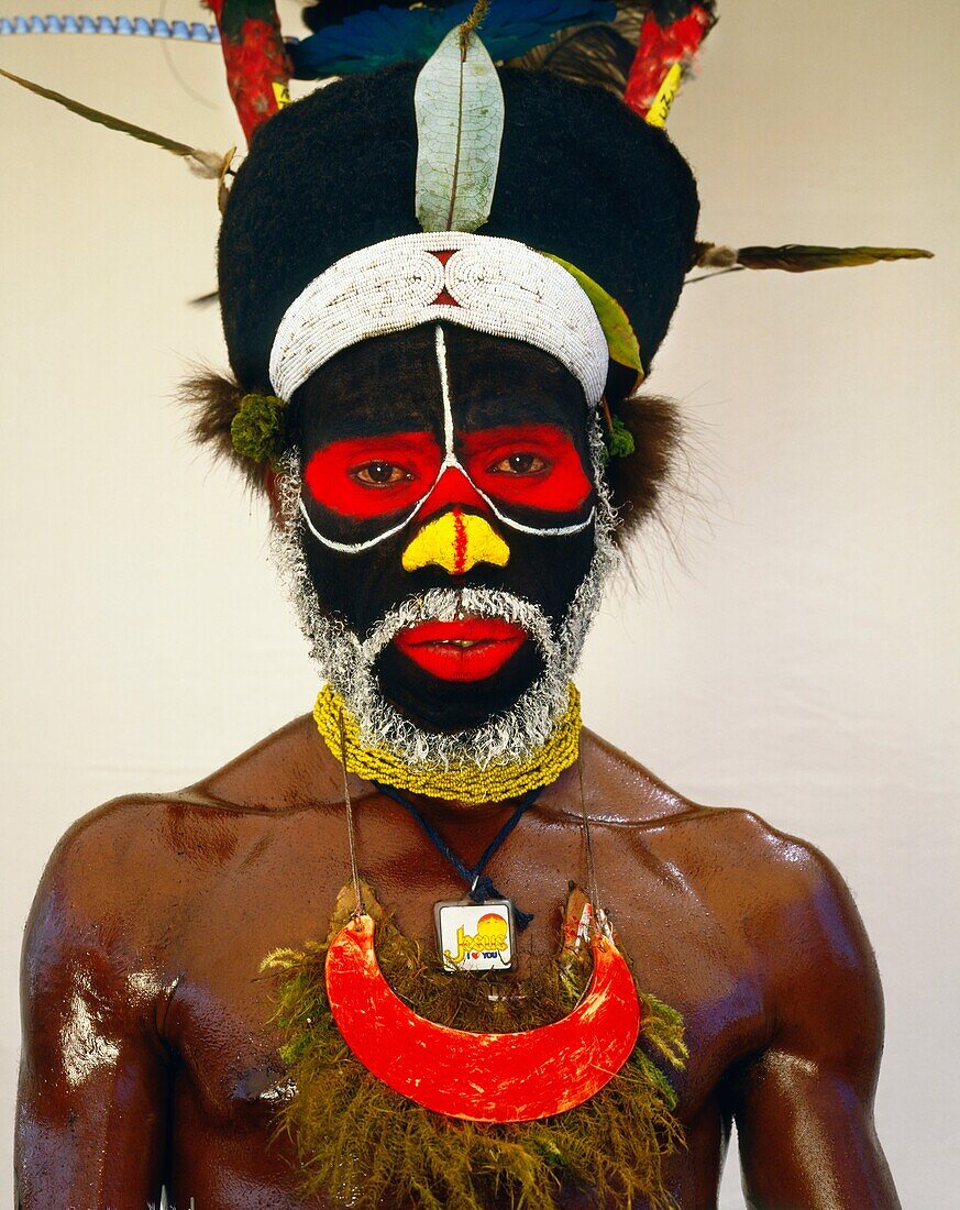 Peke Dupio from Map Village Southern Highlands of Papua New Guinea wearing a Christian emblem around his neck