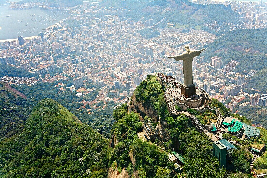 Christ the Redeemer on Corcovado Mountain, Rio de Janeiro Brazil South America The statue stands 38 m 125 feet tall and is located at the peak of the 710-m 2330-foot Corcovado mountain in the Tijuca Forest National Park, overlooking the city  As well as b