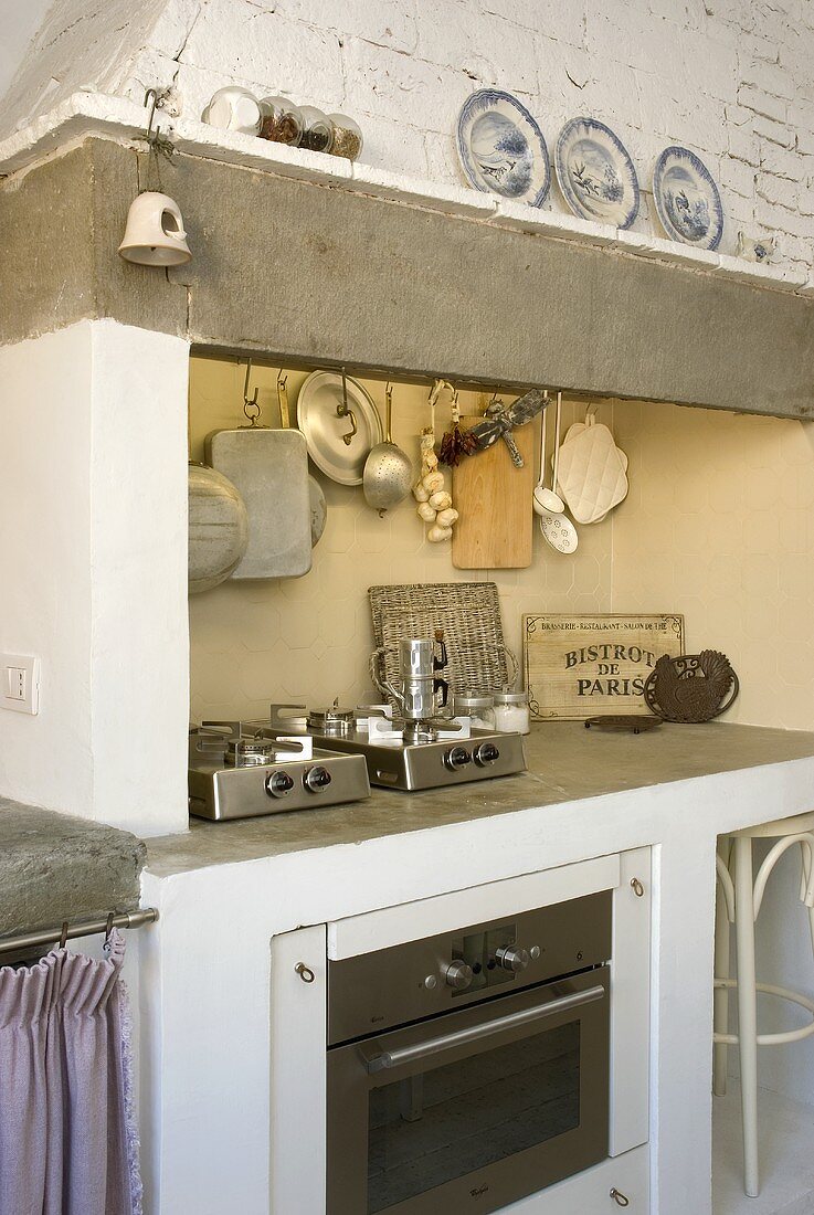 Brick kitchen unit with vent (country house style) and modern built-in appliances
